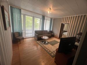 Posezení v ubytování Narva-Jõesuu Beach Residence + 31 fotografií
