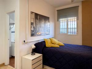 Posteľ alebo postele v izbe v ubytovaní Apartamento Huelin, A 5 MINUTOS A PIE DE LA PLAYA
