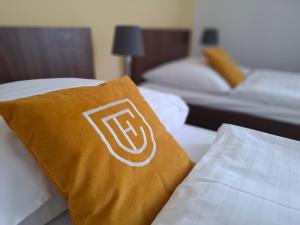 Postel nebo postele na pokoji v ubytování Hotel Eminent
