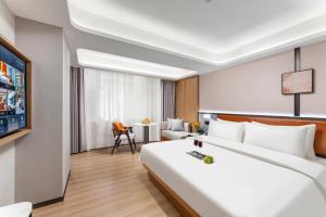 Dingshe Hotel Guangzhou Shamian Island Yongqingfang Branchにあるベッド