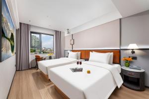 Dingshe Hotel Guangzhou Shamian Island Yongqingfang Branchにあるベッド