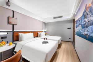 Dingshe Hotel Guangzhou Shamian Island Yongqingfang Branchにあるベッド