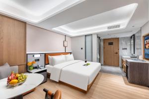 Dingshe Hotel Guangzhou Shamian Island Yongqingfang Branchにあるベッド