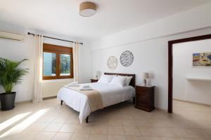 Ένα ή περισσότερα κρεβάτια σε δωμάτιο στο Villa Annatoli +21 φωτογραφίες