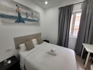 Postel nebo postele na pokoji v ubytování AYZ Silvela - Auto check-in property