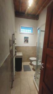 a bathroom with two toilets and a sink at Dimora toscana in Santa Maria del Giudice