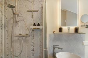 a bathroom with a shower and a sink at Ferienhaus Berger 2025 in Bad Karlshafen +54 photos