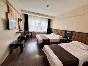 Postel nebo postele na pokoji v ubytování SİMİSSO HOTEL
