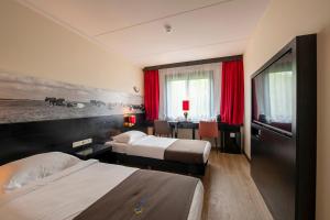 Postel nebo postele na pokoji v ubytování Bastion Hotel Den Haag Rijswijk + 18 fotografií