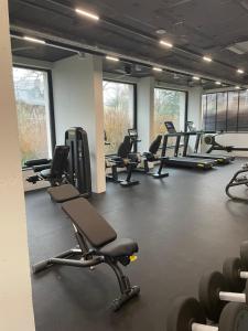 a gym with several rows of treadmills and chairs at SUNNY STUDIO AZUR in Saints Constantine and Helena