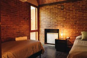 Postel nebo postele na pokoji v ubytování Winehouse in Chacras de Coria + 33 fotografií