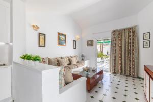 a living room with a couch and a table at Campo Golf 75 by VillaGranCanaria in Maspalomas