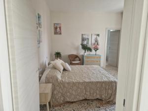 Ένα ή περισσότερα κρεβάτια σε δωμάτιο στο Casa Vacanza L'Orchidea