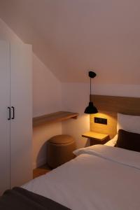 Postel nebo postele na pokoji v ubytování Leśne Chatki - domek Jodła