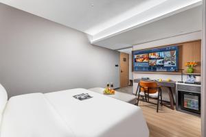 Dingshe Hotel Guangzhou Shamian Island Yongqingfang Branchにあるベッド