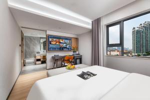 Dingshe Hotel Guangzhou Shamian Island Yongqingfang Branchにあるベッド