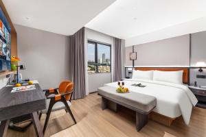 Dingshe Hotel Guangzhou Shamian Island Yongqingfang Branchにあるベッド