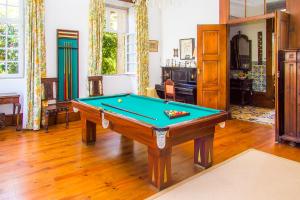 a living room with a pool table in it at Liiiving in Ofir | Manor Pool House in Fonte Boa