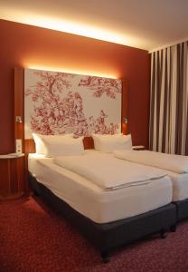 Postel nebo postele na pokoji v ubytování IBB Hotel Ingelheim