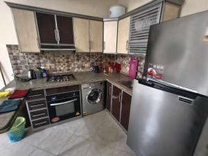 Kuchyň nebo kuchyňský kout v ubytování Apartment in port Ghalib