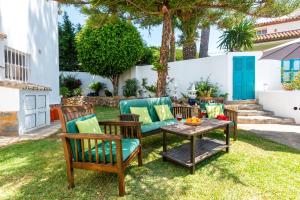 a patio with two chairs and a table at Montevistas Retreat- Cycling, Hiking, Relaxation, Valencia 25 minutes in Valencia