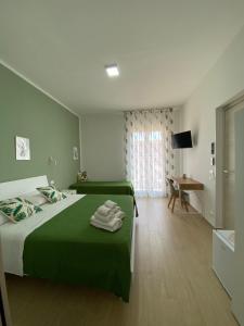 Ένα ή περισσότερα κρεβάτια σε δωμάτιο στο B&B Le Venere Rooms