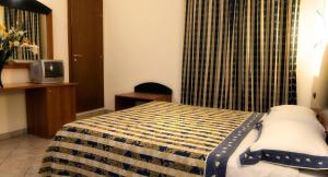 Postel nebo postele na pokoji v ubytování Hotel Marconi