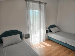 Ένα ή περισσότερα κρεβάτια σε δωμάτιο στο Village experience - Skadar lake