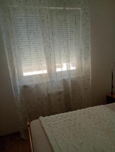 Postel nebo postele na pokoji v ubytování Apartman Sunce