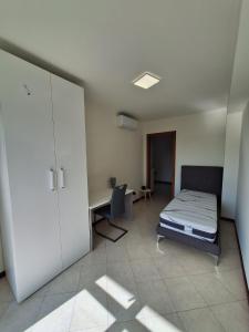 Postel nebo postele na pokoji v ubytování Panoramico Barona Duplex-Penthouse