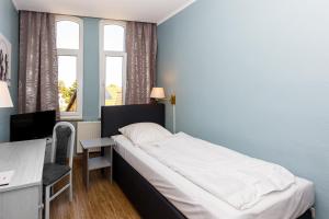 Postel nebo postele na pokoji v ubytování Apart Hotel Sarstedter Hof
