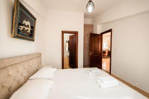 Postel nebo postele na pokoji v ubytování ALNES HOTEL