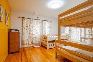 Postel nebo postele na pokoji v ubytování HAKONE Villa Rosso 037h