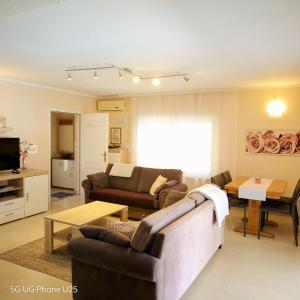 a living room with a couch and a table at Mario and Maria in Vodnjan