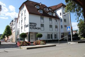 
a large brick building with a sign on the side of it at Hotel Stadt Tuttlingen in Tuttlingen
