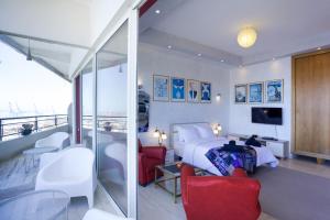 a hotel room with a bed and a balcony at Villa Paquet - Quartier Art Déco in Casablanca