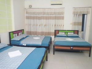 Postel nebo postele na pokoji v ubytování Motel Thanh Huyền - Bãi sau + 2 fotografie