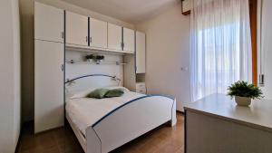 A bed or beds in a room at Condominio Sovego