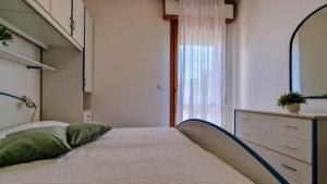 A bed or beds in a room at Condominio Sovego