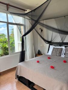 Ένα ή περισσότερα κρεβάτια σε δωμάτιο στο Jua Apartment