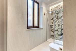Koupelna v ubytování Hotel Fori Imperiali