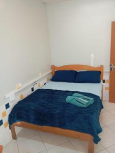 Ένα ή περισσότερα κρεβάτια σε δωμάτιο στο Pousada Central Quarto 4