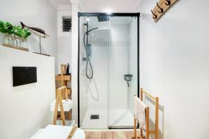 a shower with a glass door in a bathroom at AP-7 XimoApartments con VISTAS ESPECTACULARES AL MAR in Oliva +28 photos