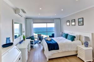 Ένα ή περισσότερα κρεβάτια σε δωμάτιο στο Villa Royale 703 +18 φωτογραφίες