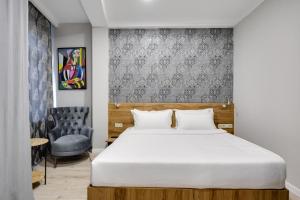 Letto o letti in una camera di Regraph Hotel