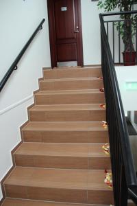 a set of stairs with a wooden door at Gargždų pramogos in Gargždai