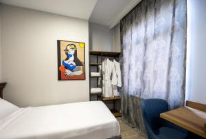 Letto o letti in una camera di Regraph Hotel