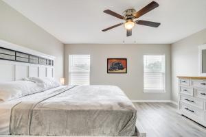 a bedroom with a bed and a ceiling fan at Hike, Paddle and Explore Home with Lanai in Ocala in Ocala