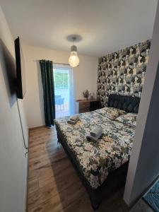 Ένα ή περισσότερα κρεβάτια σε δωμάτιο στο Apartament Residence