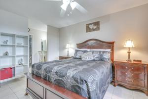 a bedroom with a bed and a dresser at 9 Mi to Pompano Beach Condo with Resort Perks! in Lauderdale Lakes +16 photos